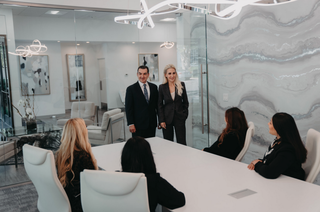 attorneys of the tiemann law firm in their conference room
