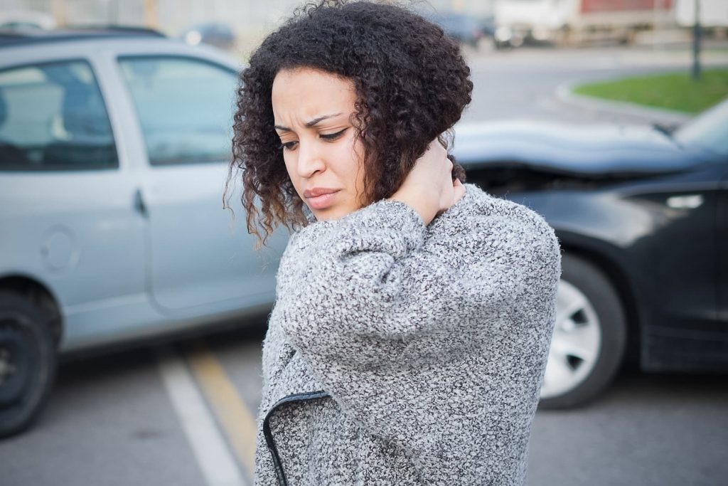 Lady holding her neck after an accident