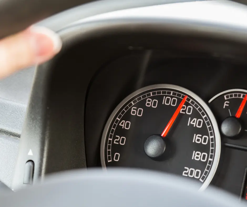 closeup of speedometer topping 100 mph